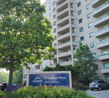 Main entrance to 535 Proudfoot Place surrounded by trees