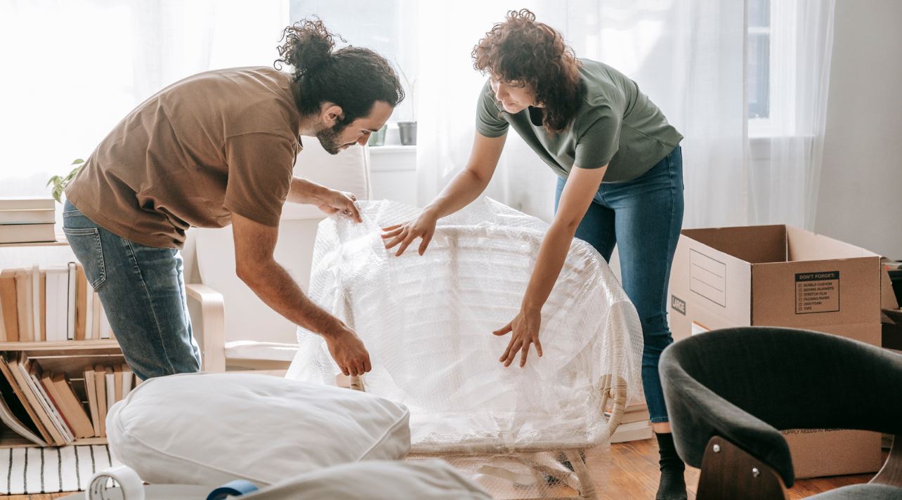 Man and woman packing their apartment