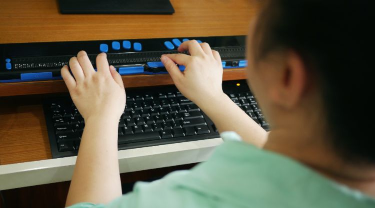 A braille keyboard being used in an office.