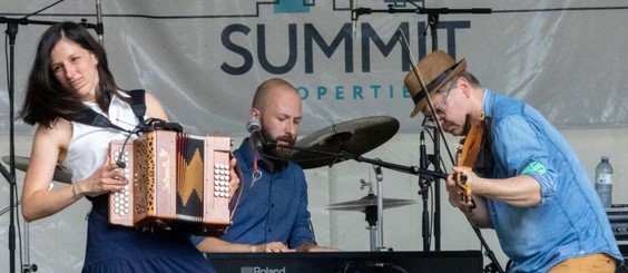 Musicians performing at Sunfest festival, a partner of Summit Properties
